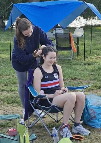 Chloe helping Josie with hair