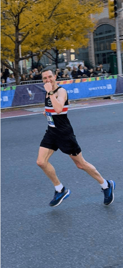 Fist-pumping at mile 16 of the New York City Marathon